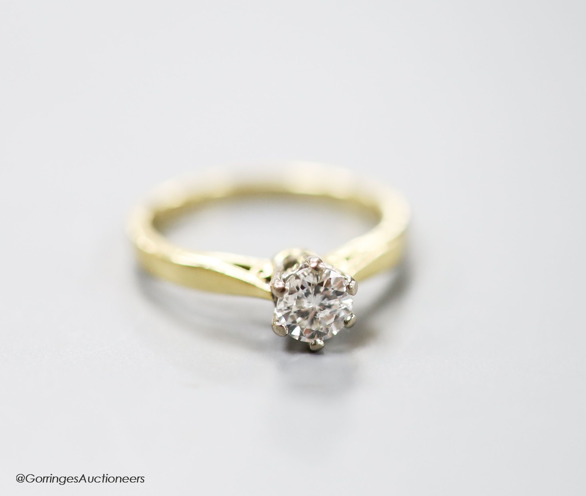 A modern 18ct gold and solitaire diamond ring, size L, gross weight 3.2 grams.
